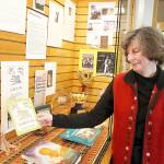 Pat Gardner, member of Whidbey Island Genealogy Searchers, holds her contribution to the clubs womens history display at Oak Harbor Library. Photo by Laura Guido/Whidbey News-Times