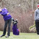 Nick Krantz tees off at the third hole as teammate Haven Brown looks on.(Photo by John Fisken)