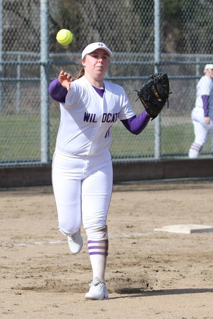 Oak Harbor third baseman Kayla Crocker tosses to first for an out against Lakewood.(Photo by John Fisken)