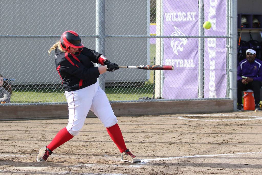 Coupevilles Veronica Crownover blasts a pitch off the fence against Oak Harbor.(Photo by John Fisken)