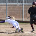 Oak Harbors Kait Scheer lays out to force a Lakewood runner at first.(Photo by John Fisken)