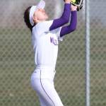Oak Harbors Miranda Wilson runs down a Coupeville fly ball.(Photo by John Fisken)