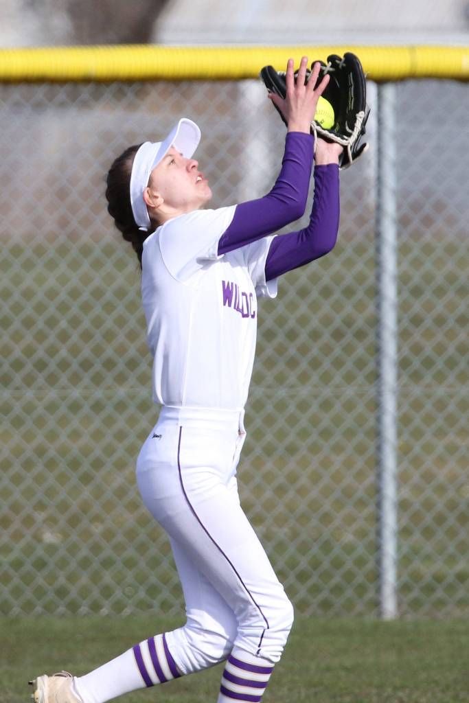 Oak Harbors Miranda Wilson runs down a Coupeville fly ball.(Photo by John Fisken)