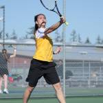 Jasmine Schultz smacks an overhand shot against Stanwood.(Photo by John Fisken)