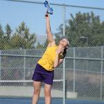MJ Timm powers a serve in Mondays match.(Photo by John Fisken)