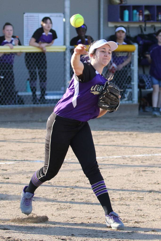 Oak Harbor pitcher Cierra LeGendre throws to first after fielding a ground ball.(Photo by John Fisken)