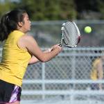 Elica Atienza returns a shot in her second doubles win with Olivia Lerch. (Photo by John Fisken)