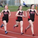 Coupevilles Catherine Lhamon, Lucy Sandahl and Alana Mihill run the 1,600.(Photo by John Fisken)