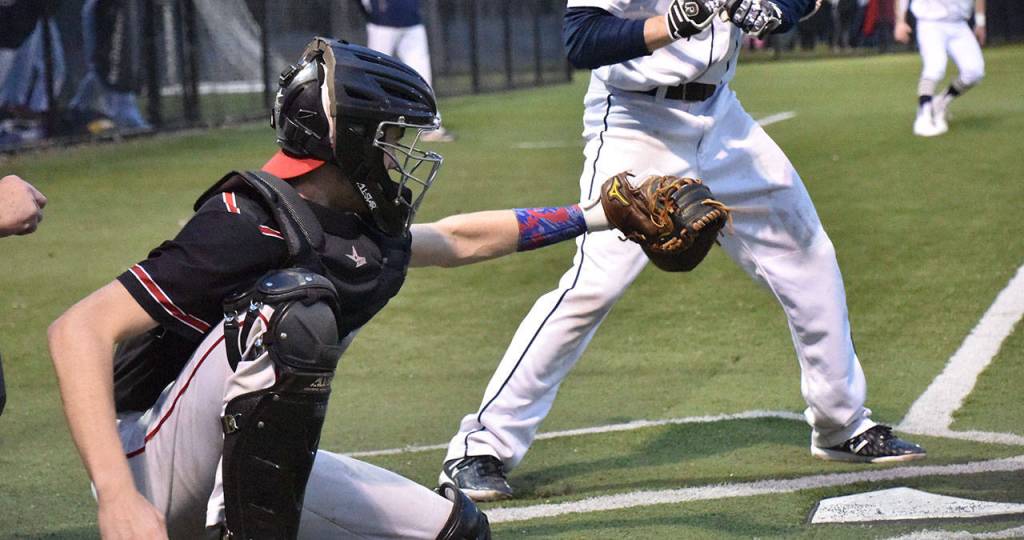 Coupeville catcher Gavin Knoblich looks in a pitch.(Photo by Karen Carlson)