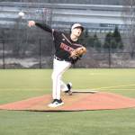Daniel Olson cuts loose with a pitch.(Photo by Karen Carlson)