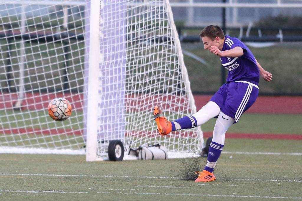 Ridgely Briddell boots the ball against Getchell.(Photo by John Fisken)