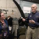 Stephanie Ashcroft, Sunrise Services Health Home care coordinator, listens to Wil Shellenberger, president of the PBY Memorial Foundation, as he gives her a tour of the PBY Naval Air Museum. The foundation, with a monetary donation from State Farm, provided Ashcroft with 200 tickets so her Health Home clients could visit the museum for free. Photo by Laura Guido/Whidbey News-Times