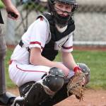 Coupeville catcher Mason Grove looks to the bench for the pitch call. (Photo by John Fisken)