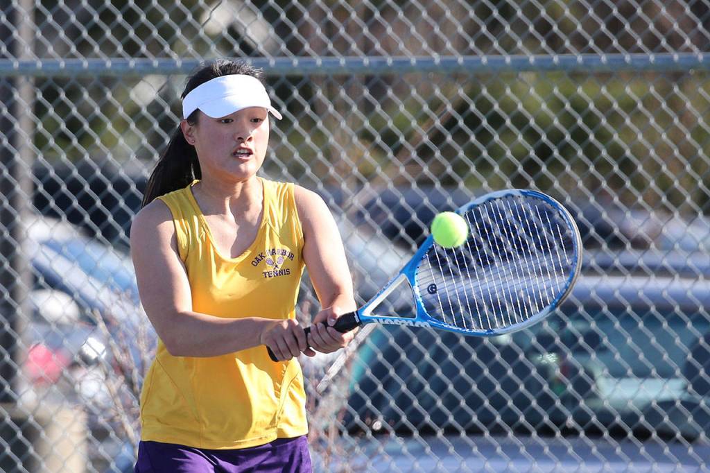 MJ Timm volleys in her first singles match.(Photo by John Fisken)