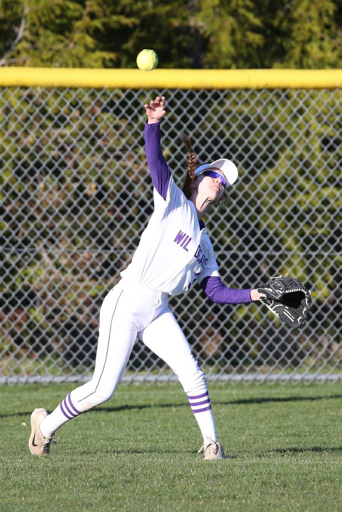 Wildcat center fielder Miranda Wilson tries to gun down a Lynnwood runner.(Photo by John Fisken)