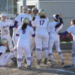 Oak Harbor greets Kayla Crocker at the plate after Crocker smashed a home run Tuesday. (Photo by John Fisken)