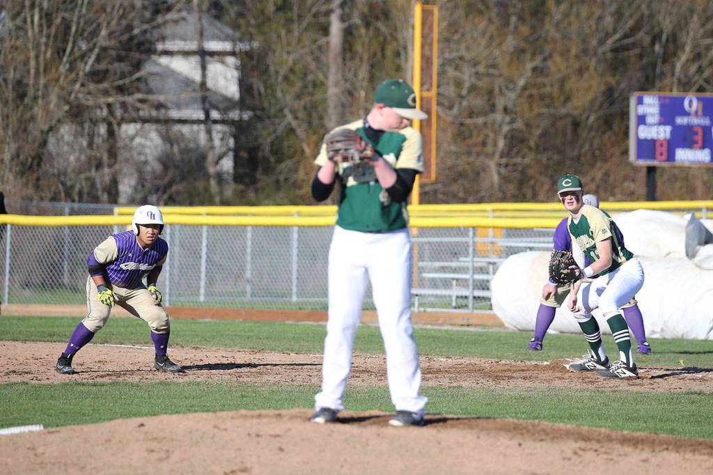 Oak Harbors Donny Kloewer, left, leads off first base Tuesday.(Photo by John Fisken)