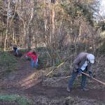 Land Trust volunteers Nancy South, left, Sue Payton, and Robert Payton work on building a new trail in Central Whidbey that will be part of the future Walking Ebeys Trail System. Photo provided