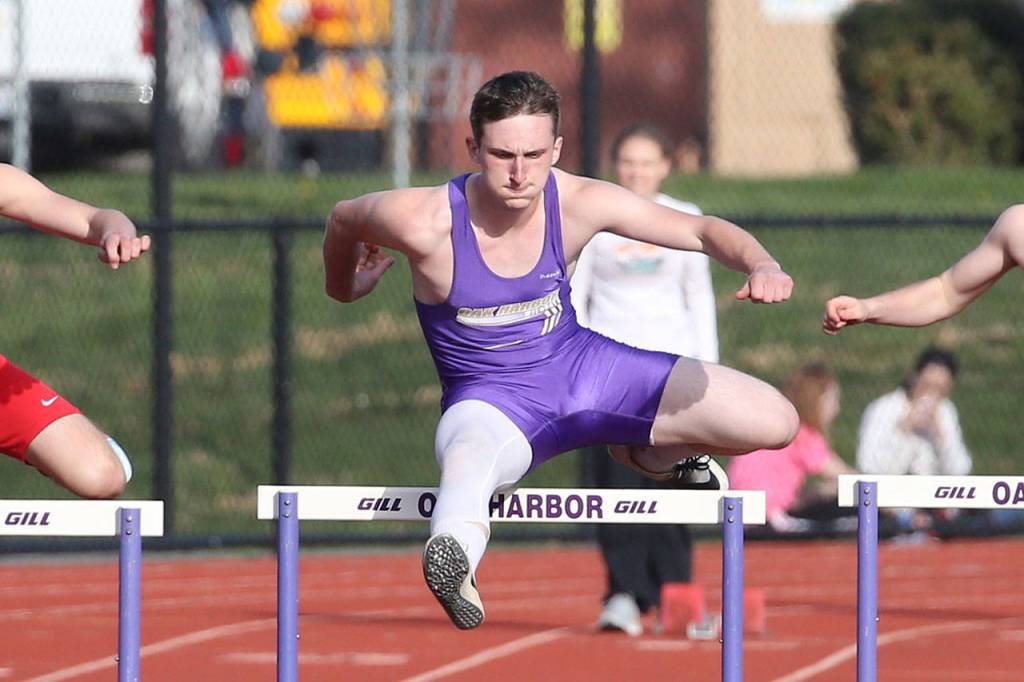 Gabriel Daggett flies to third place in the 300 hurdles.(Photo by John Fisken)