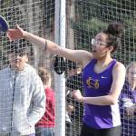 Jasmine Ford launches the discus for Oak Harbor.(Photo by John Fisken)