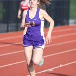 Oak Harbors Natalie French runs to first place in the 400 meters in Thursdays double-dual meet.(Photo by John Fisken)