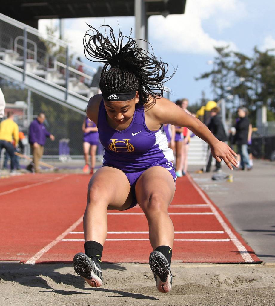 Tiana Jackson sticks the landing in the long jump.(Photo by John Fisken)