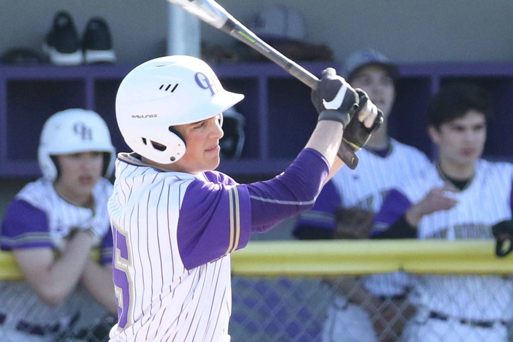Austin Boesch puts the ball in play for Oak Harbor.(Photo by John Fisken)