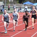 Lindsey Roberts, far right, hands the baton to JaKenya Hoskins in the 4x200 relay.(Photo by John Fisken)