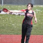 Willow Vick places fifth in the discus.(Photo by John Fisken)