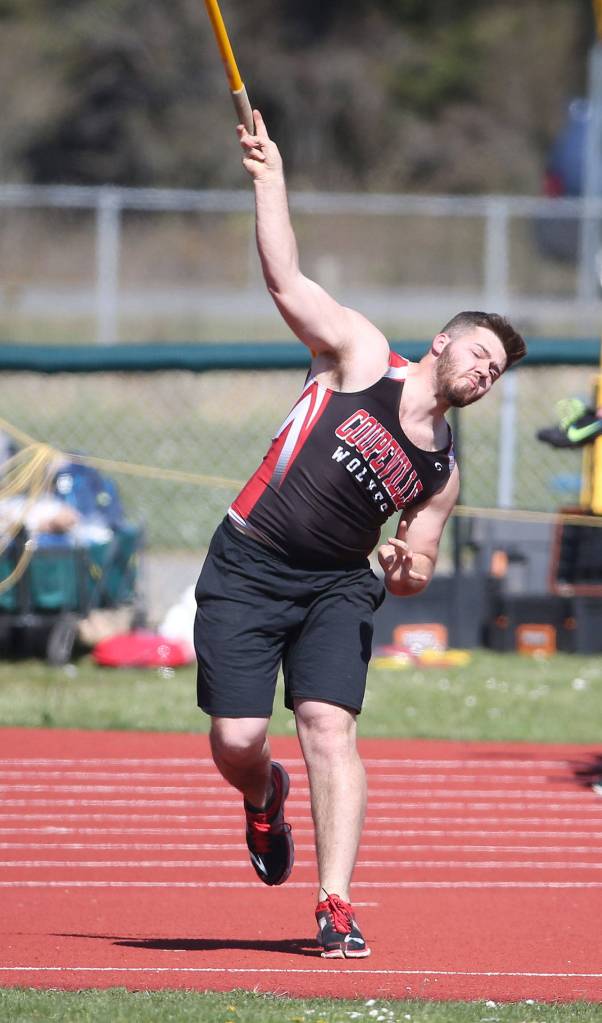 Chris Battaglia fires the javelin for the Wolves. (Photo by John Fisken)