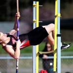 Kyle Burnett soars in the pole vault.(Photo by John Fisken)