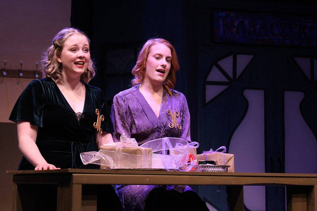 As sales clerks in the Whidbey Playhouse musical, She Loves Me, Katherine Lof (left) as Amalia Balash and Emily Hoyt as Ilona Ritter, commiserate about the woes of romance.