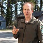 Chris Holm, Central Whidbey area manager for Washington State Parks, explains how around 300 tiny myotis bats should be able to fit in the narrow slots of new bat boxes installed at Fort Casey. The boxes were put in as an alternative for a maternity colony that had been roosting in the park offices attic. Photo by Laura Guido/Whidbey News Group