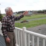 Photo by Jessie Stensland / Whidbey News-Times.                                Robert Brown points to an area where the Navys EA-18 Growler aircraft can be seen from the deck of his house.