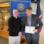 Photo provided.                                Michael Fisken with Club President Todd Krantz.