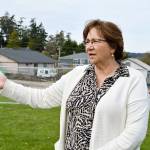 Coupeville Mayor Molly Hughes explains how the towns farmers market will look while construction of a new municipal parking lot is underway. Photo by Laura Guido/Whidbey News-Times