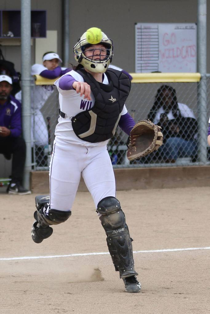 Wildcat catcher Sam Scott fires to first base.(Photo by John Fisken)