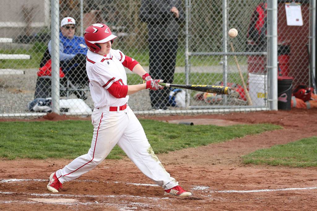 Shane Losey puts the ball in play.(Photo by John Fisken)