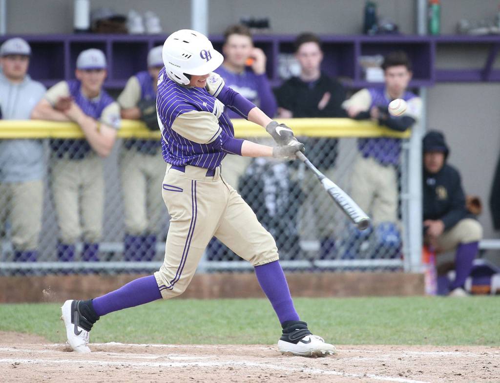 Austin Boesch puts the ball in play for the Wildcats Tuesday.(Photo by John Fisken)