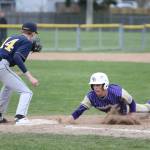 Oak Harbors Austin Boesch, right, slides safely back into first base Tuesday as Everetts Casen Taggart receives the pickoff throw.(Photo by John Fisken)