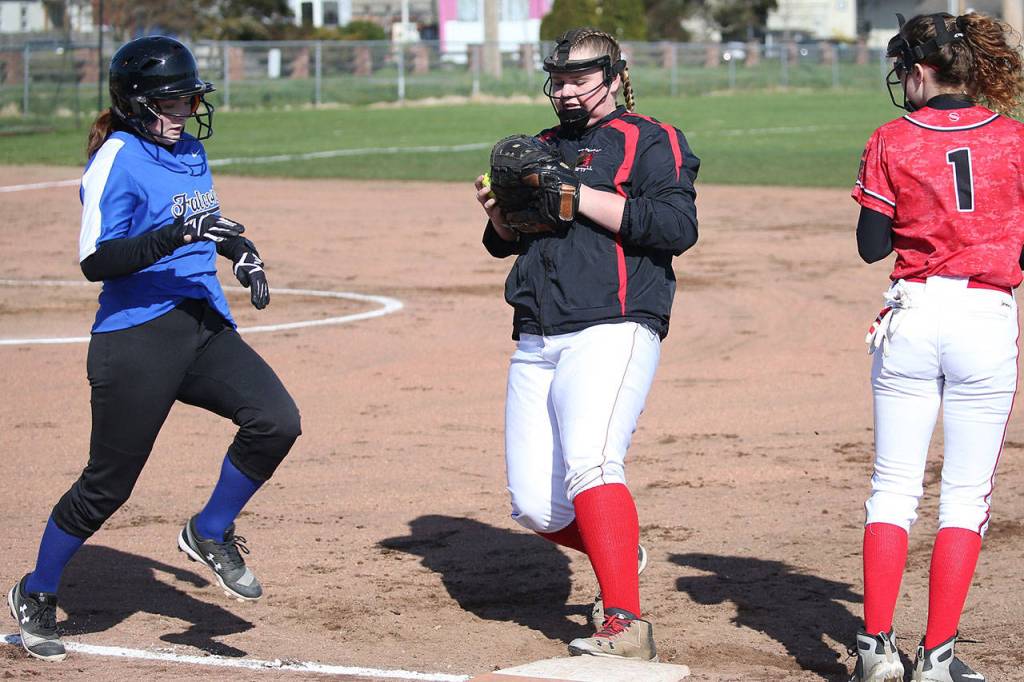 Coupevilles Veronica Crownover tags first to force out a South Whidbey runner as second baseman Coral Caveness (1) comes over to help out. (Photo by John Fisken)