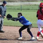 Coupevilles Scout Smith (7) reaches first base before South Whidbeys Melody Wilkie makes the catch as umpire Randy James looks on.(Photo by John Fisken)