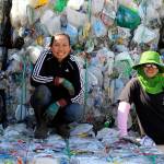 Photos by Patricia Guthrie/Whidbey News Group<em></em>                                <em>Yu Williams, left, and Polly Schweer pose on the mounds of plastic that they bundle to get ready for hauling from Freelands Island Recycling. They are the miracle workers of this place, says owner Jill Campbell. </em>
