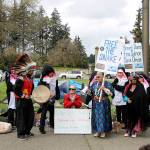 Members of the Palouse Tribe join the protest lead by tribal elder, Carrie Chapman-Schuster, who was forcibly removed from her land in 1959 in order for the lower Snake River dams to be built. Lanni Johnson is seated at center.  Photo by Emma Emperly, WNPA Olympia News Bureau