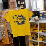 Events Manager Vicki Graham shows off this years t-shirt designs.                                (Photo by Maria Matson)