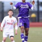 Taiveyon Shaw heads the ball forward for Oak Harbor.(Photo by John Fisken)