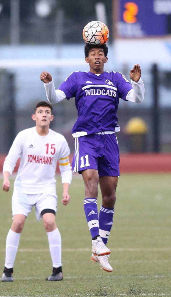 Taiveyon Shaw heads the ball forward for Oak Harbor.(Photo by John Fisken)