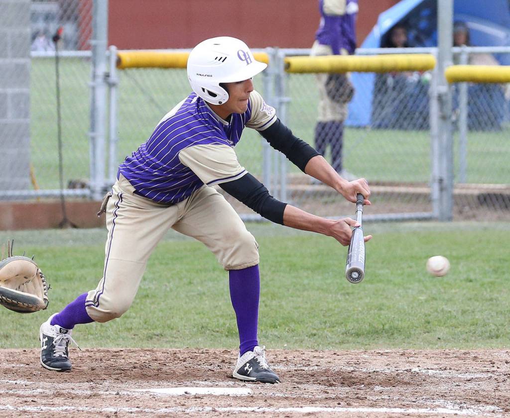 Oak Harbors Caleb Fitzgerald attempts to put down a bunt.(Photo by John Fisken)