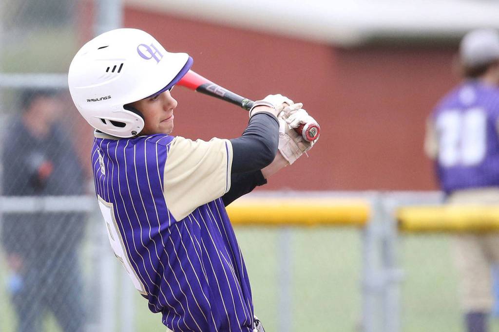 Gage McLeod singles for the Wildcats.(Photo by John Fisken)