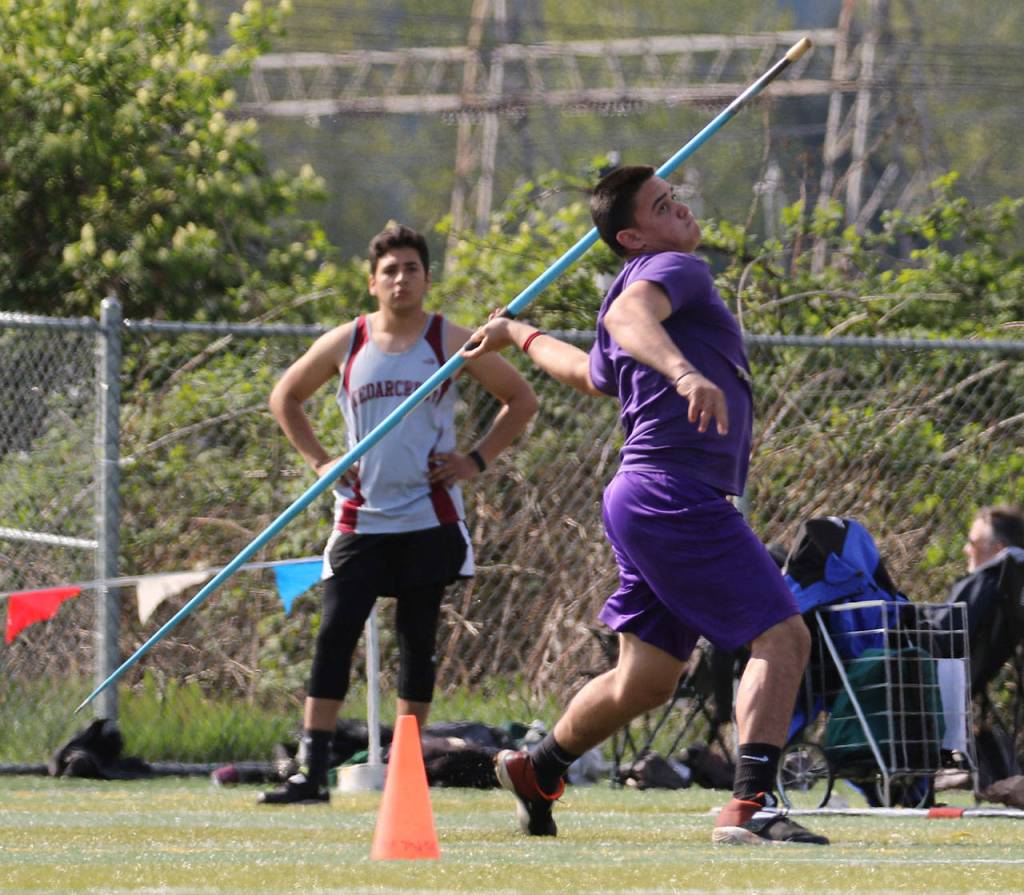 Oak Harbors Michael Gomez launches the javelin for the Wildcats.(Photo by John Fisken)